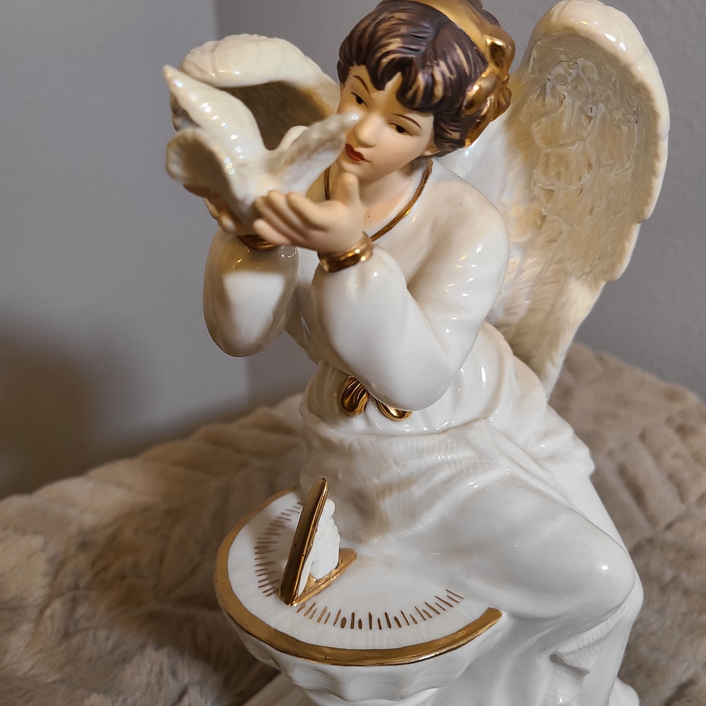 Ivory Ceramic Angel Figurine with Gold Accents